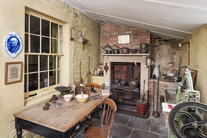 A Victorian Kitchen Extension with a table topped with utensils, a range and a mangle.