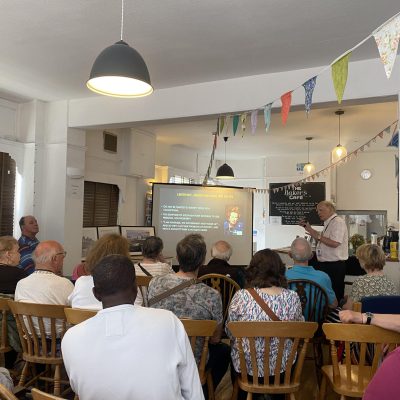 Picture of inside the Bakers Café room during a presentation/talk.